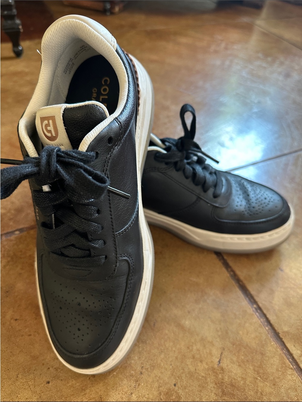 Cole Haan Black Leather Low-Top Sneakers with White Soles and Tan Logo Tab
